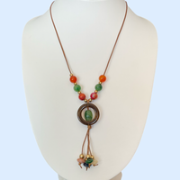 Bijoux | Collier en babiche brune avec pendentif en forme de cercle brun