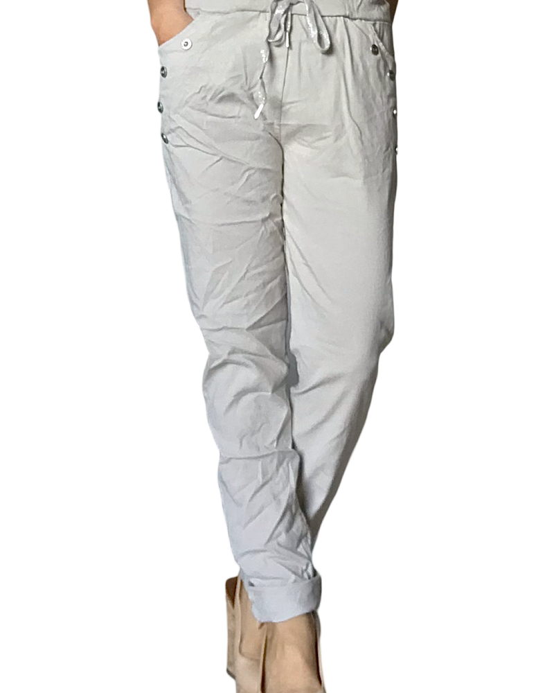 Pantalon beige à taille élastique avec cordon et boutons décoratifs